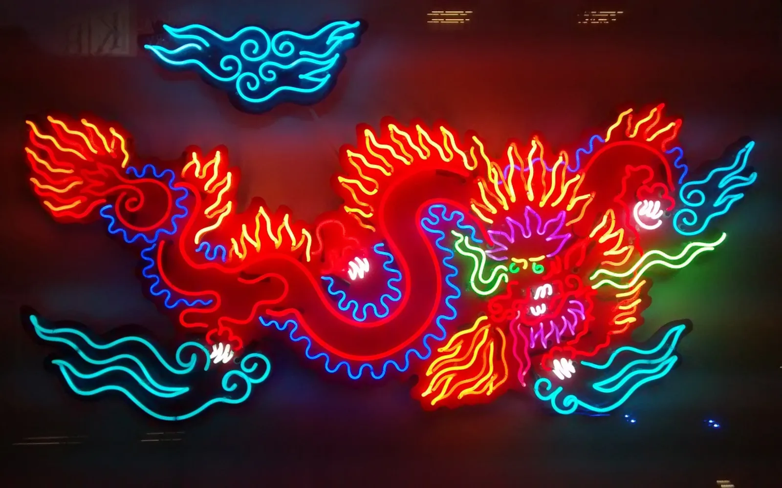 A dragon rendered in neon lights displayed on the exterior of the Museum of Neon Art in Glendale
